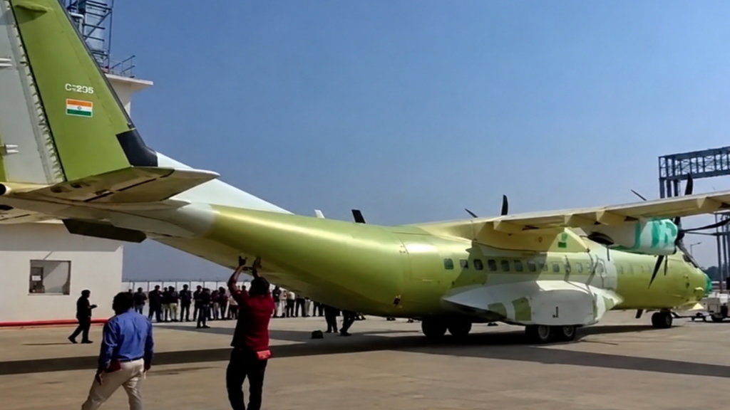 C-295 aircraft India, Tata Airbus C-295, Made in India military aircraft, Tata Advanced Systems, Airbus India partnership, Vadodara C-295 facility, Indian Air Force C-295, India defence manufacturing, indigenous military aircraft, Atmanirbhar Bharat defence, India aerospace manufacturing, Narendra Modi defence project, C-295 transport aircraft, Airbus C-295 India rollout, India military cargo aircraft, Tata Group defence sector, IAF transport aircraft, C-295 tactical airlifter, India Spain defence cooperation, Avro replacement aircraft, An-32 replacement, Gujarat defence manufacturing, Airbus Tata facility Vadodara, India self reliance in defence, military aircraft assembled in India