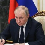 Vladimir Putin image, Vladimir Putin official photo, Russian President Vladimir Putin image, Putin desk meeting photo, Vladimir Putin government office image, Putin official portrait.