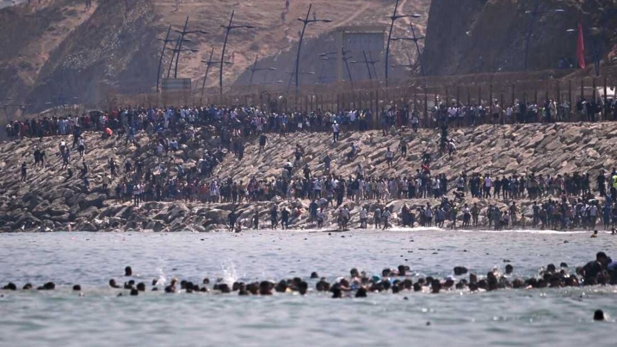 At least 57 dead as 60,000 migrants cross into Spain’s Ceuta, prompting military deployment 